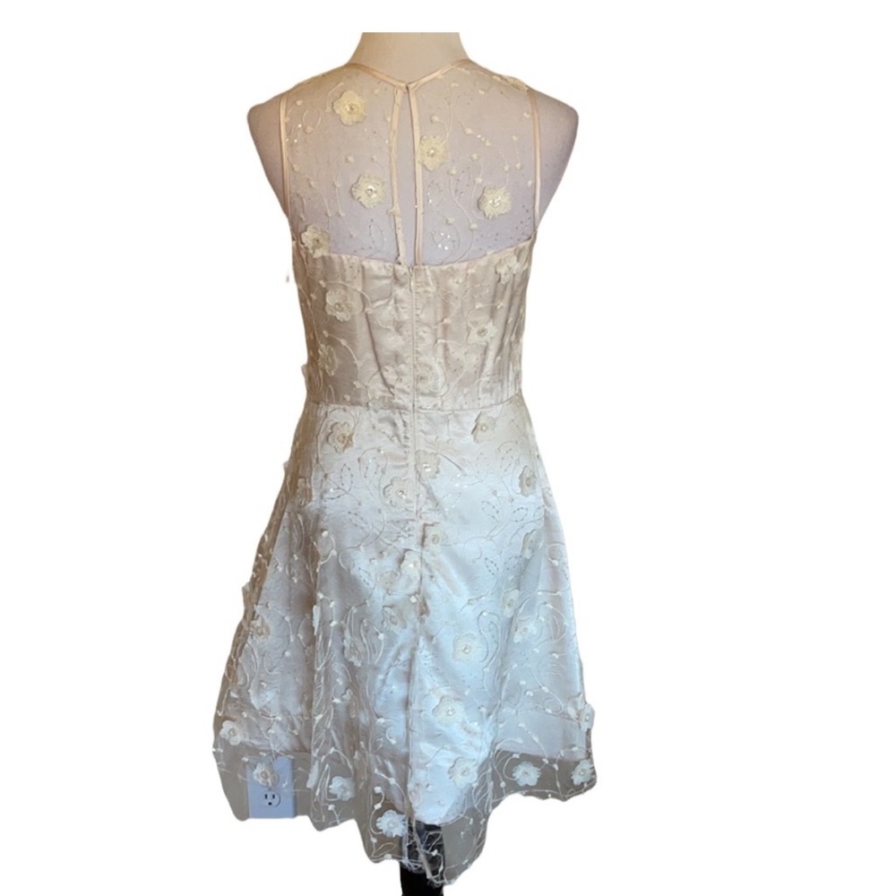 Taylor Dress size 8 beautiful lace with embellishment over ivory lining.